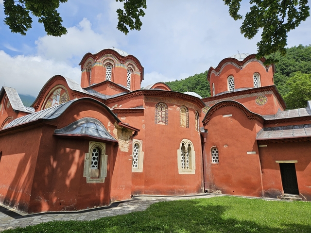 Exterior view of a red-bricked monastery