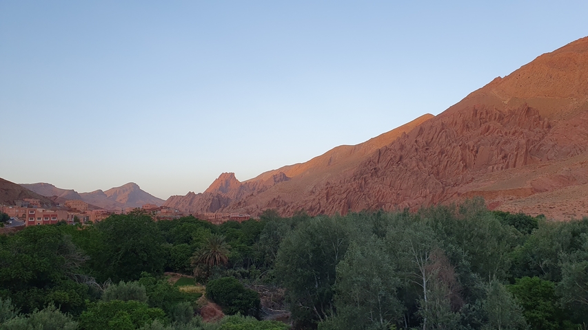       Scenic view of a landscape with hills and greenery.
  