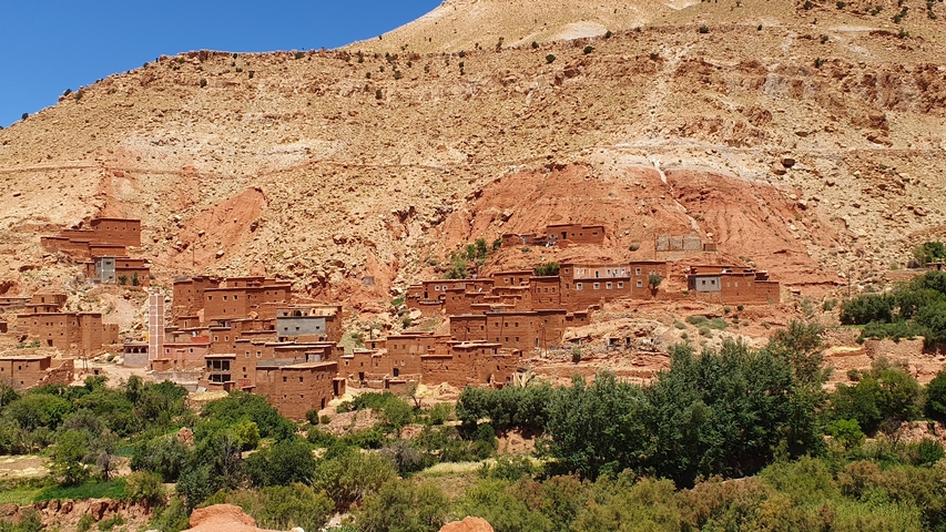       Traditional village houses built into the hillside.
  
