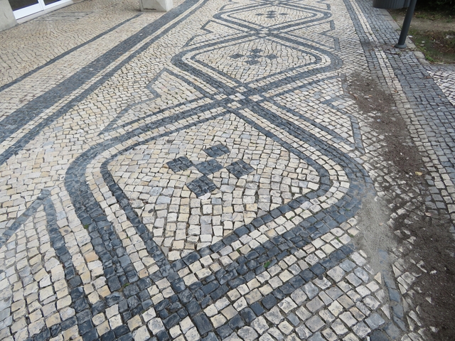       Tiled pavement with a geometric pattern.
  