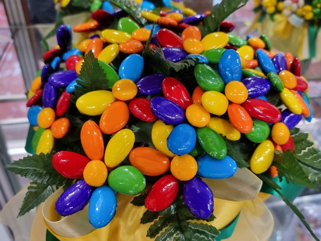 Colorful bouquet made from candy-like items shaped as flowers.