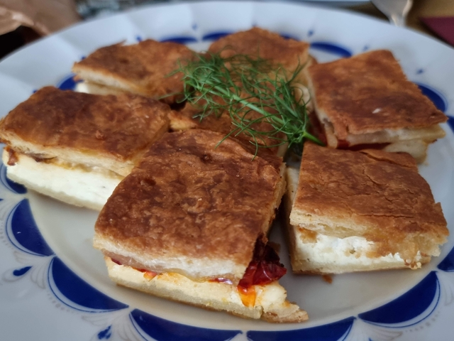 Plate of square pieces of savory pastry