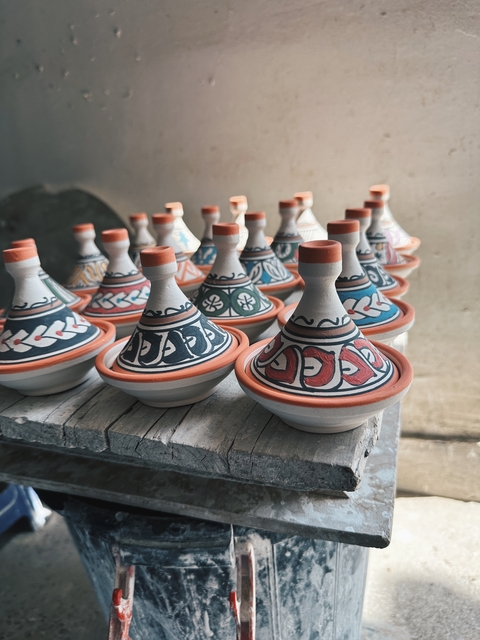       Small decorative tagines on display
  