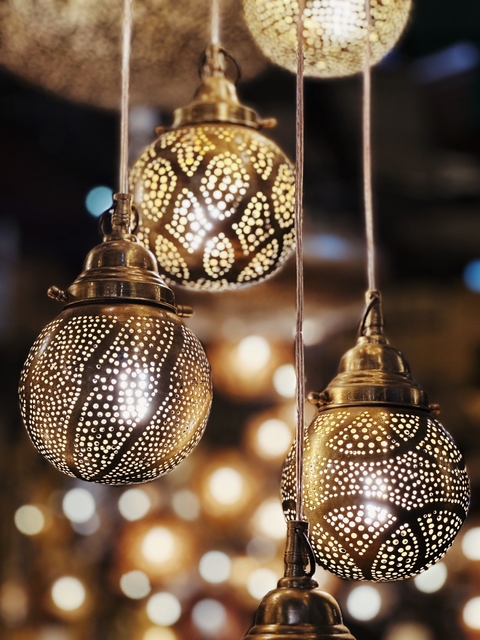 Ornate brass lamps with intricate patterns