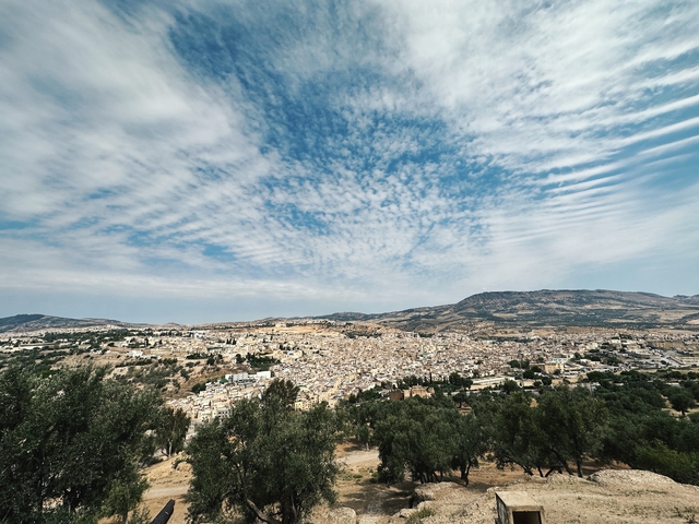 Panoramic view of a city and surrounding hills