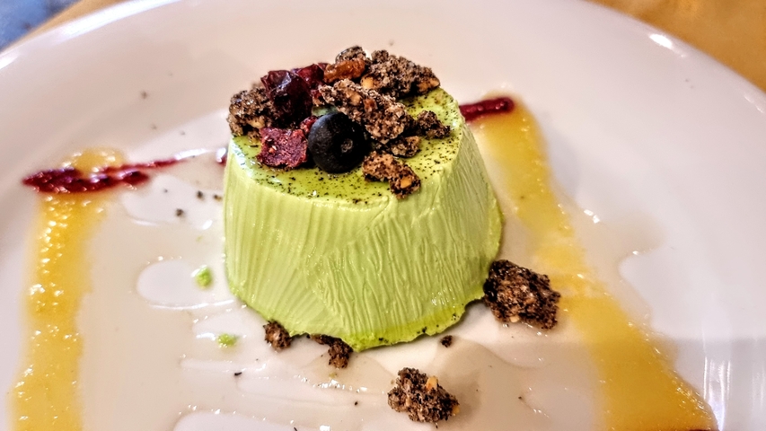       Dessert topped with berries and drizzle
  