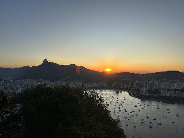 Rio de Janeiro at sunset with a view of the Christ the Redeemer statue.