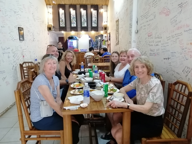       Group of people dining together in a casual restaurant.
  