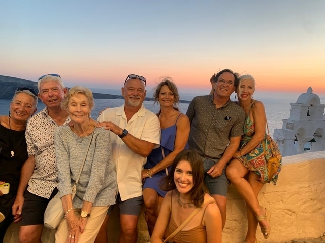 Group of people enjoying sunset in Santorini