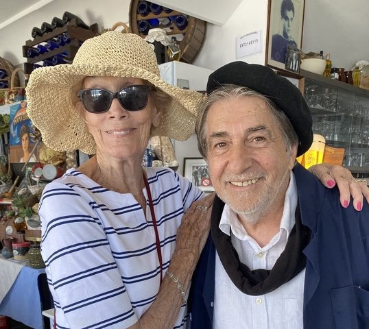 Close-up of two people in a cafe setting