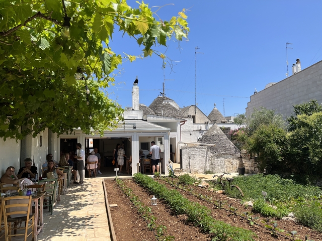 Outdoor dining area in a beautiful garden setting.