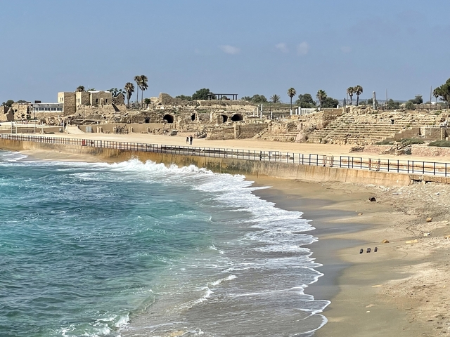       Coastal ruins with waves crashing on the shore.
  