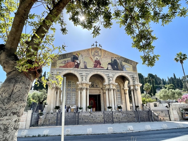The Church of All Nations surrounded by lush greenery.