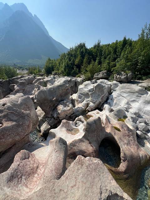 Rocky landscape with distant mountains.