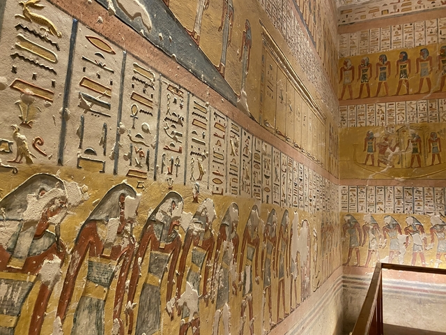 Intricately decorated ancient Egyptian wall with hieroglyphs.