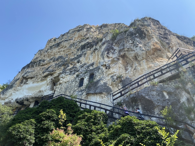 Cliffside monastery built into a rock formation.