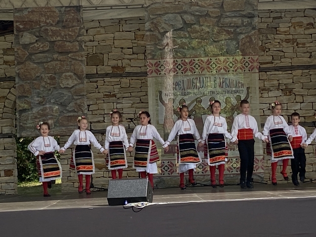 Children performing traditional dance in colorful costumes.