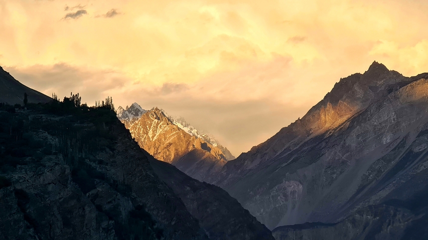       Sunset illuminating mountain peaks.
  