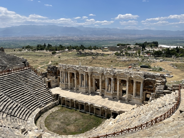       Ancient amphitheater with a detailed view of the stage front.
  