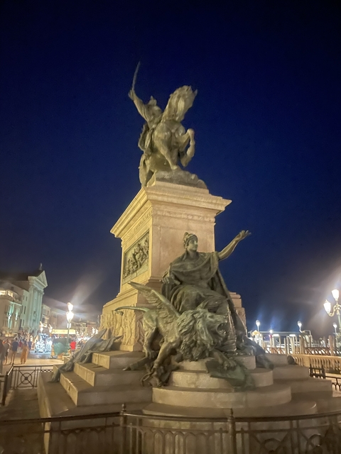 Blurry statue at night.