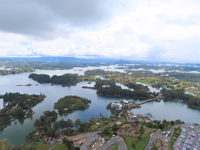       Aerial view of a landscape with lakes and small islands.
  