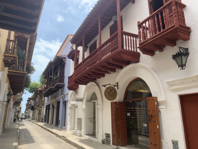       A charming street with colonial-style buildings.
  