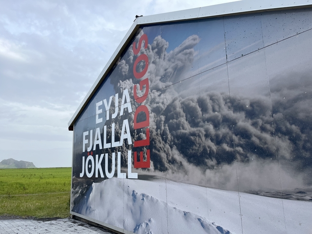       Sign for Eyjafjallajökull volcano with cloud imagery.
  