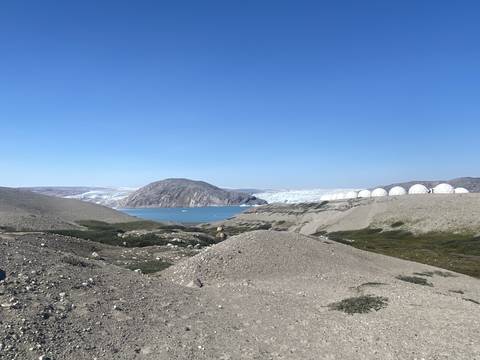       Landscape with glaciers, mountains, and domes in the distance.
  