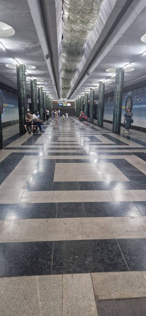 People waiting in a modern underground station