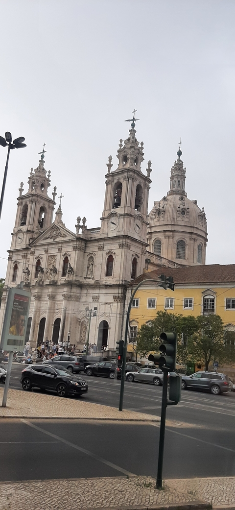       Domed building with detailed architectural features and statues.
  