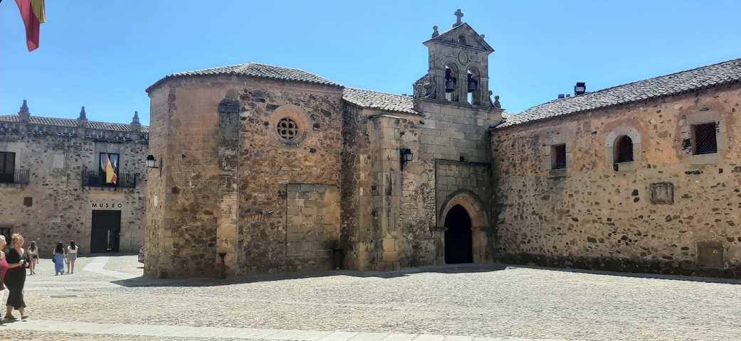Small church with detailed stone architecture and a museum.