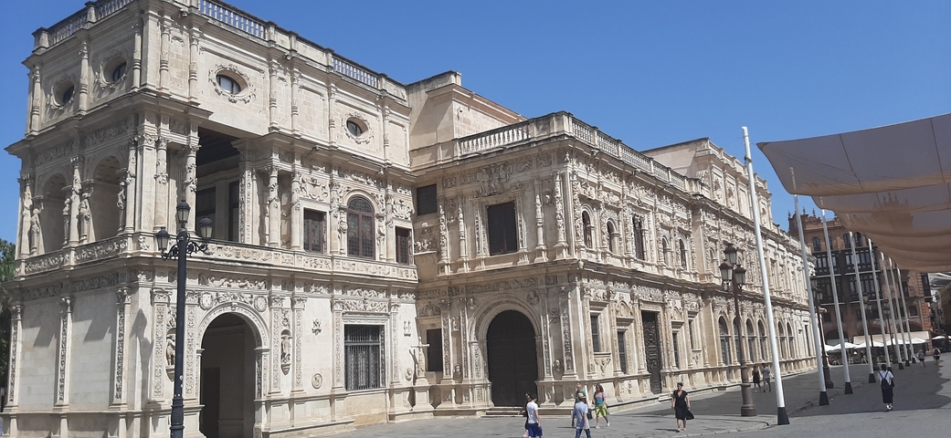       Ornate historic building in a public square.
  