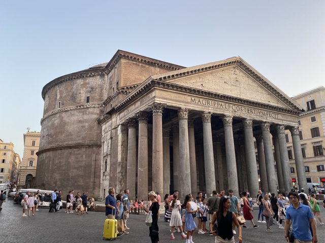       Pantheon surrounded by people.
  
