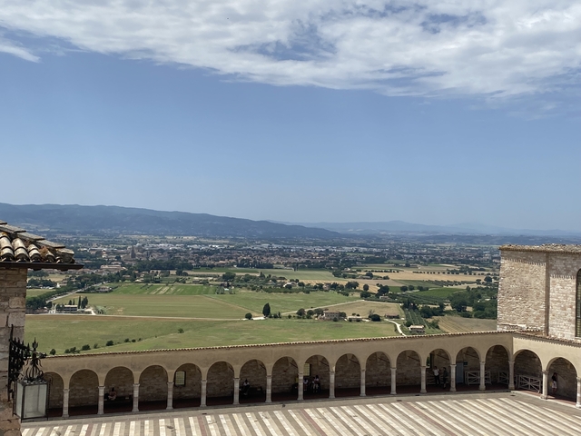       Vast landscape with historical buildings in the foreground.
  