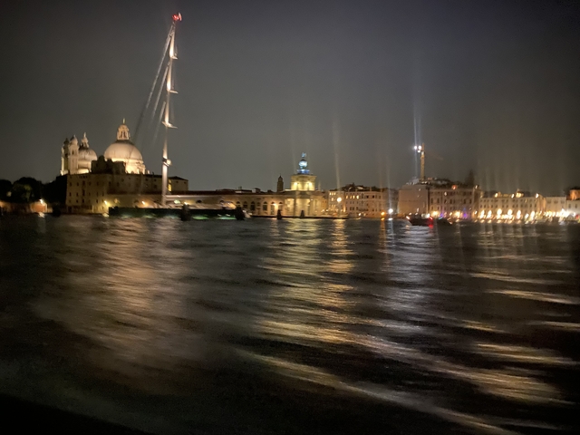       Nighttime view of waterfront buildings.
  