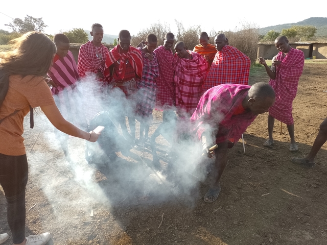 Group of Maasai people performing a cultural activity.