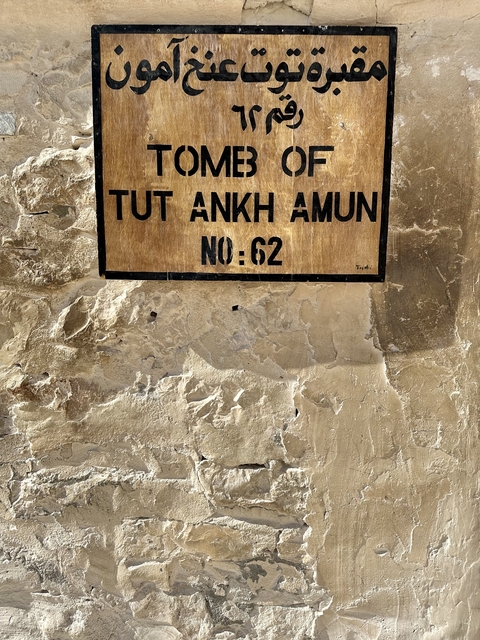       Close-up of a plaque with 'TUT ANKH AMON No: 62' inscription.
  