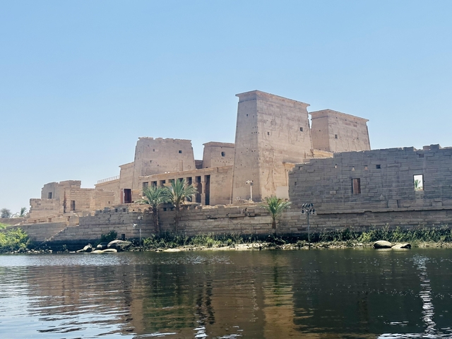 Temple on the Nile River with clear blue sky.