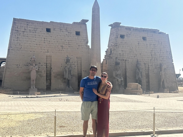 Couple posing in front of Luxor Temple.