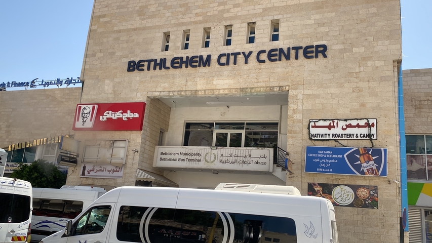       Bethlehem City Center with people and vehicles present.
  
