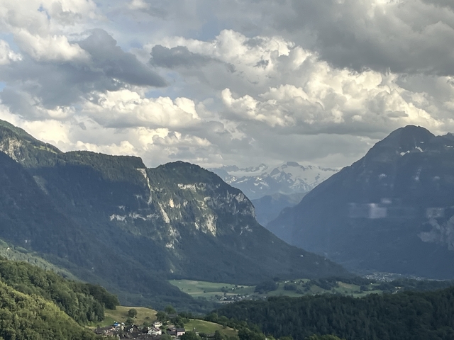       Scenic mountain landscape with clouds.
  