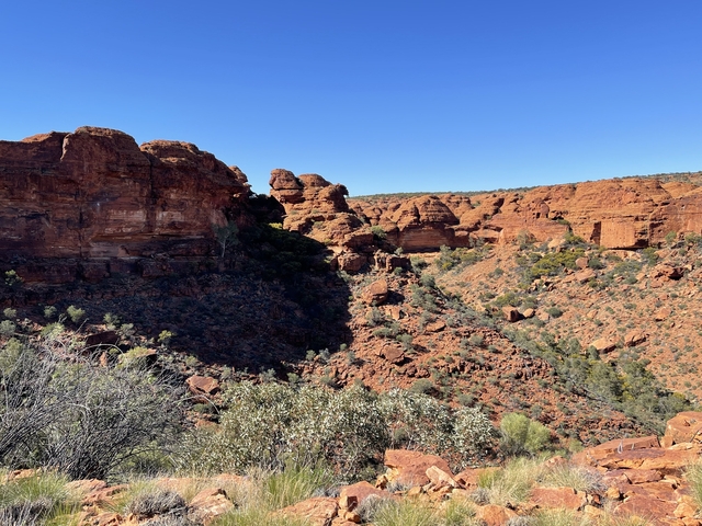 Red rock canyon landscape under a clear blue sky.