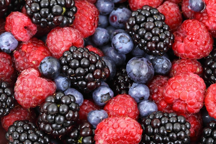 Close-up of mixed berries, including raspberries and blackberries.