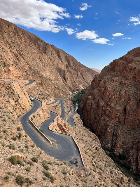       Winding road through a rocky gorge.
  