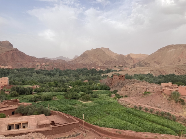       Verdant valley landscape with lush vegetation and mountains.
  