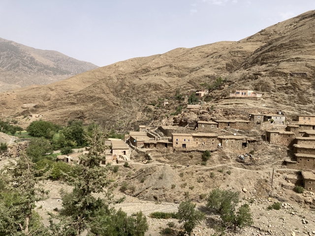       Rural village with houses built into the landscape.
  