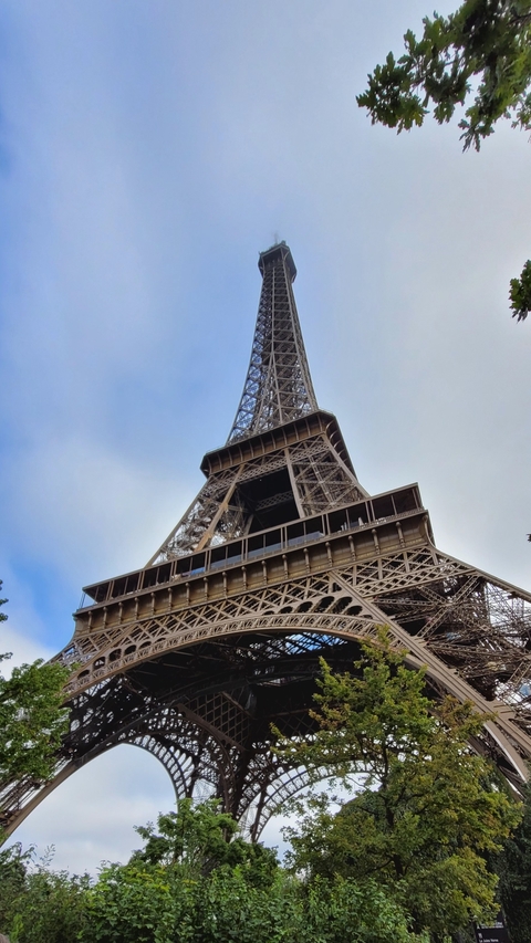 Eiffel Tower against a clear blue sky.