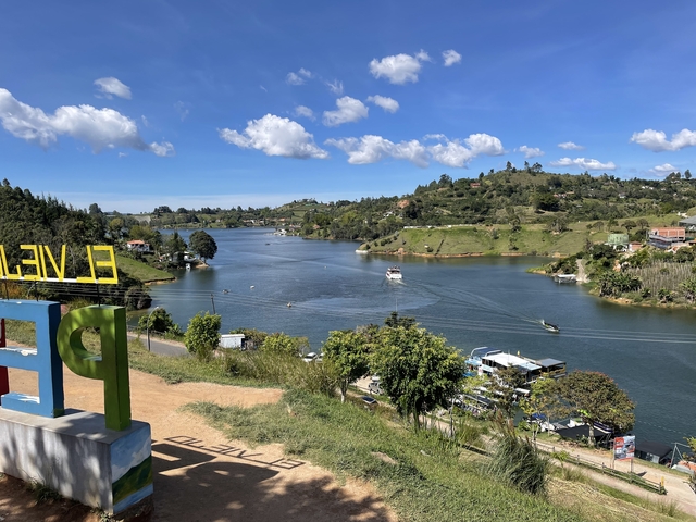       Lake with boats and clouds in the sky
  