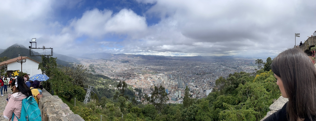       Panoramic view of a city with a mountain backdrop
  