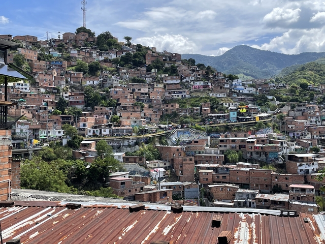       Hillside neighborhood with stacked houses
  